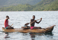 Fishermen paddling typical Malawi-lake canoe
