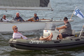 On the left relaxed the famous yachting photographer Erik Lähteenmäki on his rib, with Mr Pekka Barck, the co-author of the six-metre book Sexornas Jakt, and with Tim Street the book The Six Metre: 100 years of racing.
Erik's photos are found at www.sailpix.fi