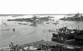 Blekholmen ja Klippan 1931. NJK:n talon vasemmalla puolella näkyy Emil Suortin veistämö, oikealla puolella Blekholmens Båtvarv. Postikortti, korttikeskus, Ari Alhamon kokoelma, kuvaaja tuntematon