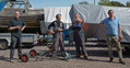 Matti Ervamaa and Petri Wilska, the partners at eightmeter Windy (FIN-8), are standing in the middle Mr Aleksi Koskelin, partner at 8 mR Sagitta, is enjoying a soft drink on the left.