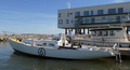 "Asteria" and the skipper are waiting for transport to the harbour to be shipped first to Belgium. Boat's number 6 (underlined) reflects Lehtinen's long experiences in the 6 mR-class sailing.